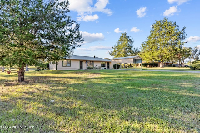 ranch-style house with a front lawn