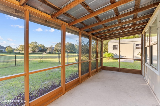 unfurnished sunroom with vaulted ceiling