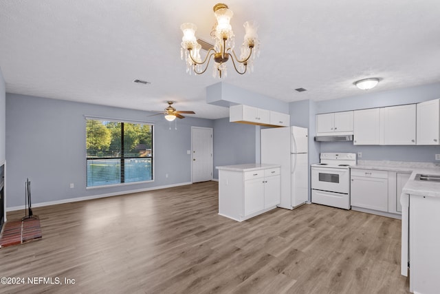 kitchen featuring white appliances, ceiling fan with notable chandelier, pendant lighting, light hardwood / wood-style flooring, and white cabinets