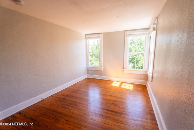 empty room featuring hardwood / wood-style flooring