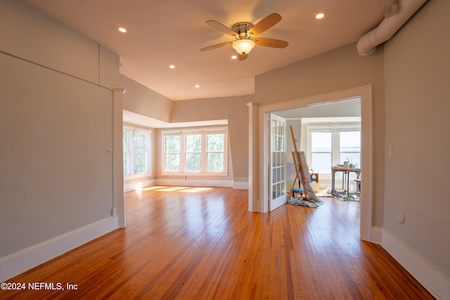 unfurnished room with hardwood / wood-style flooring and ceiling fan