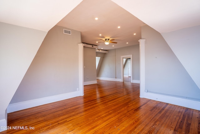 additional living space with ceiling fan and wood-type flooring