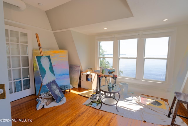 rec room featuring lofted ceiling and hardwood / wood-style floors