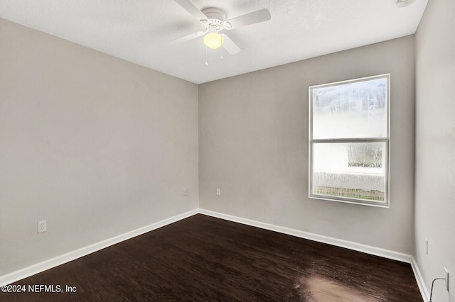 empty room featuring ceiling fan and hardwood / wood-style flooring