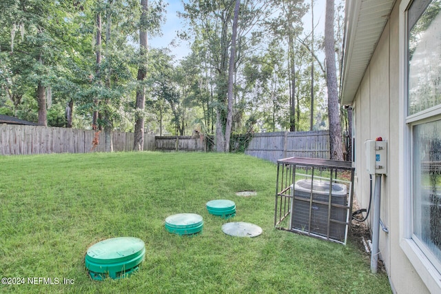 view of yard featuring central air condition unit