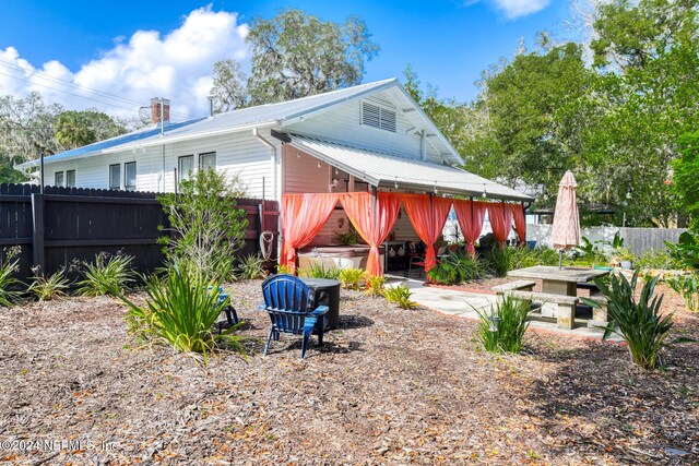 rear view of house with a patio