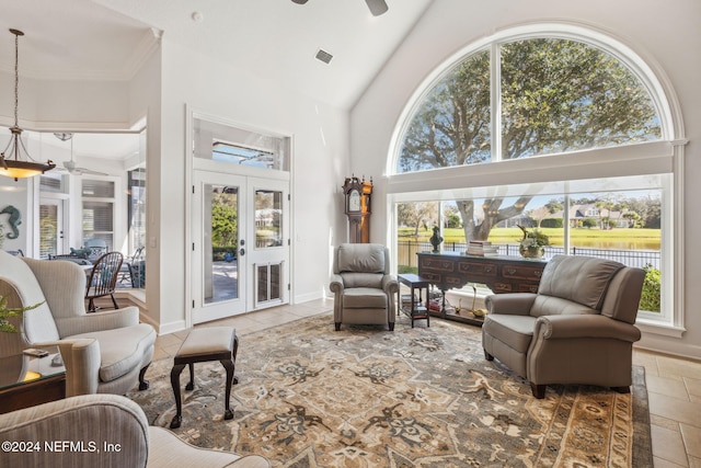 living room featuring high vaulted ceiling and ceiling fan