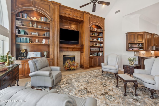 living room featuring high vaulted ceiling, ceiling fan, light tile patterned flooring, a fireplace, and built in features