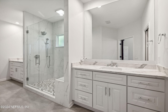 bathroom featuring walk in shower and vanity