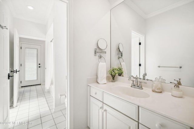 bathroom featuring vanity, tile patterned floors, and crown molding