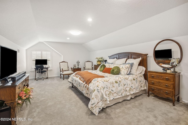 bedroom with light carpet and vaulted ceiling