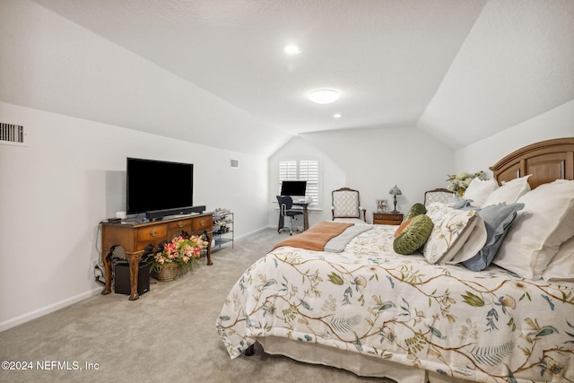 carpeted bedroom featuring vaulted ceiling