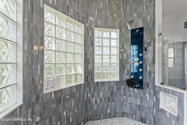 bathroom with tile walls