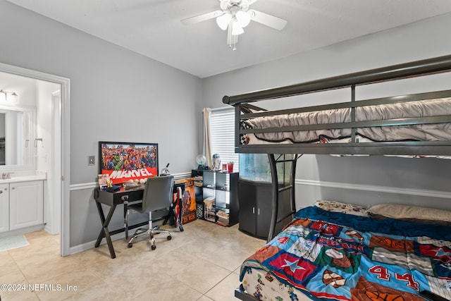 bedroom featuring ensuite bath, ceiling fan, and light tile patterned floors