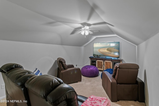 cinema featuring light carpet, vaulted ceiling, and ceiling fan