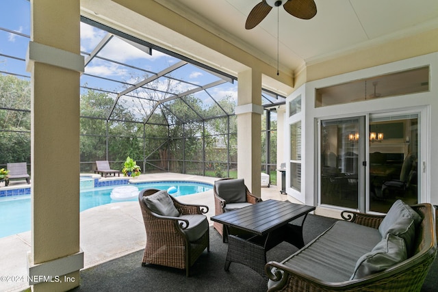 view of patio with glass enclosure and ceiling fan