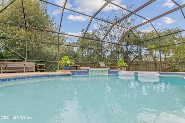 view of swimming pool with a lanai