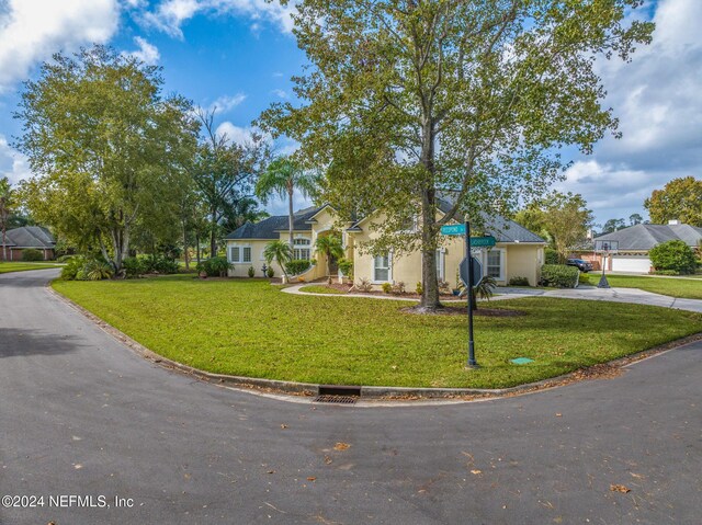 view of front of property with a front lawn