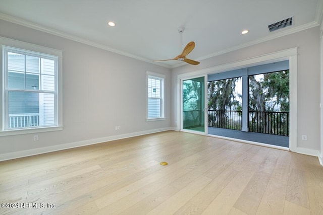 unfurnished room featuring ceiling fan, light hardwood / wood-style flooring, and ornamental molding