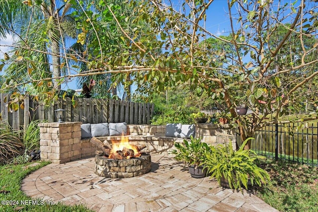 view of patio / terrace featuring a fire pit