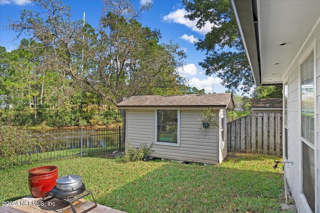 view of outbuilding featuring a lawn