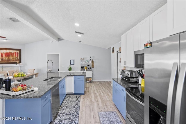 kitchen featuring stainless steel appliances, sink, light wood-type flooring, and white cabinets