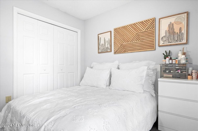 bedroom with a closet and a textured ceiling