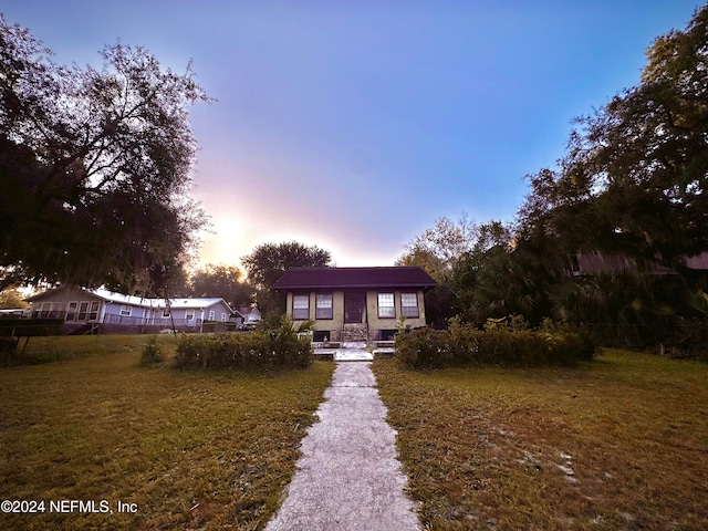 view of front of house with a lawn