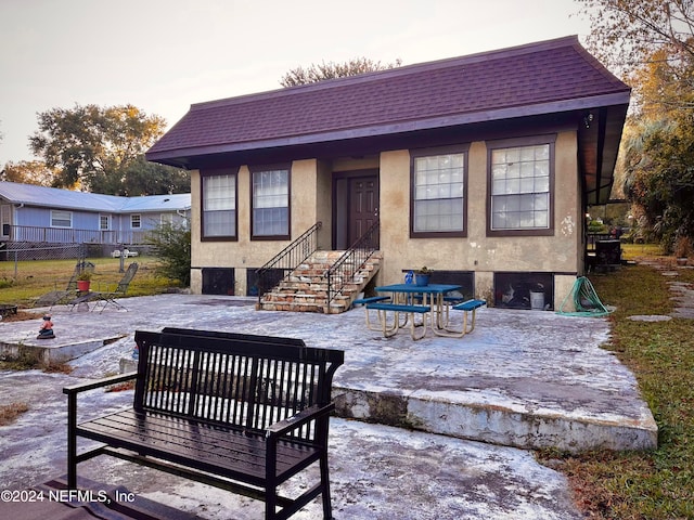 rear view of property with a patio area