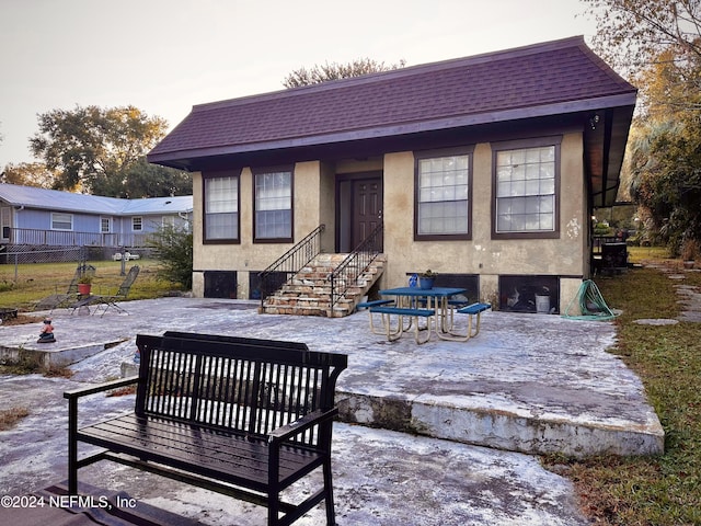 5609 County Road 352, Keystone Heights, FL 32656 - back of property featuring a patio area, stucco siding, fence, and roof with shingles
