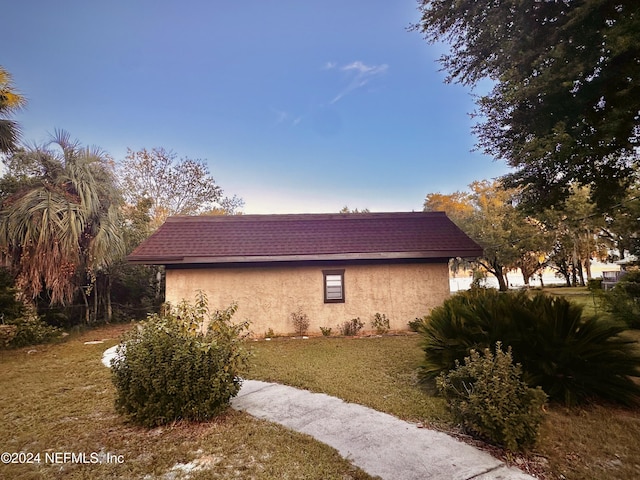 5609 County Road 352, Keystone Heights, FL 32656 - view of property exterior with stucco siding and a yard