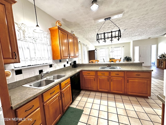 5609 County Road 352, Keystone Heights, FL 32656 - kitchen with black dishwasher, a sink, white electric stovetop, a peninsula, and brown cabinetry