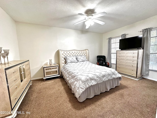 bedroom with carpet, multiple windows, and ceiling fan