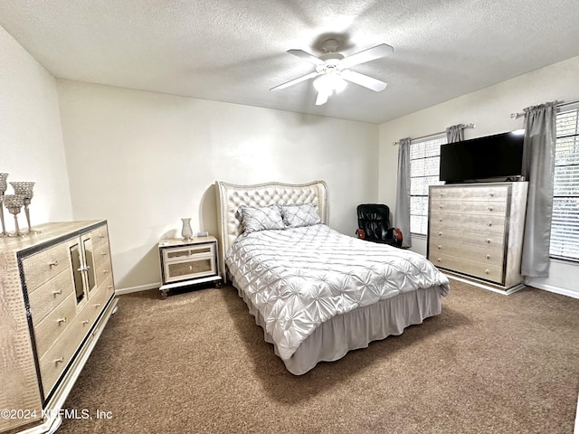 5609 County Road 352, Keystone Heights, FL 32656 - bedroom featuring dark colored carpet, a textured ceiling, baseboards, and a ceiling fan