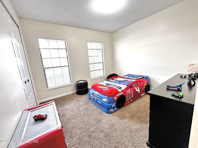 5609 County Road 352, Keystone Heights, FL 32656 - bedroom featuring a closet, carpet, and baseboards