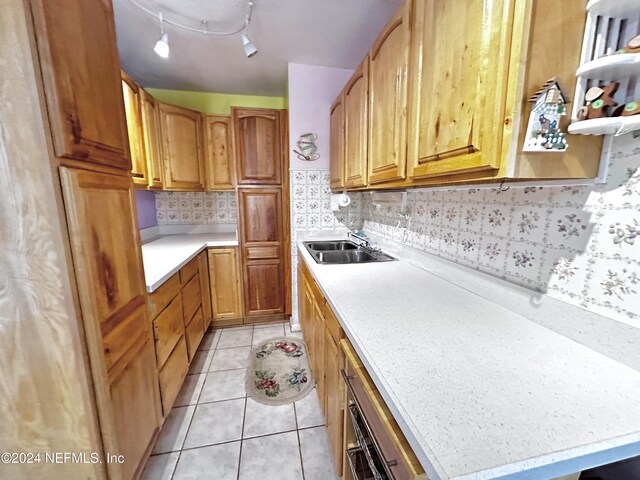 5609 County Road 352, Keystone Heights, FL 32656 - kitchen featuring a sink, light countertops, light tile patterned flooring, and tasteful backsplash