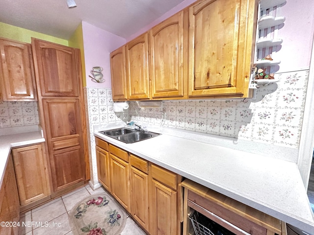 kitchen with sink and light tile patterned floors