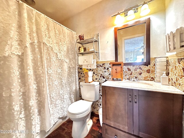 5609 County Road 352, Keystone Heights, FL 32656 - full bathroom with toilet, vanity, a wainscoted wall, and a shower with shower curtain