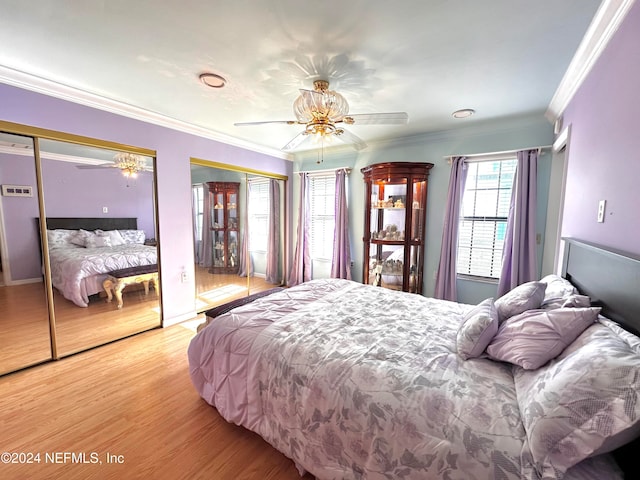 bedroom featuring ornamental molding, wood-type flooring, and ceiling fan