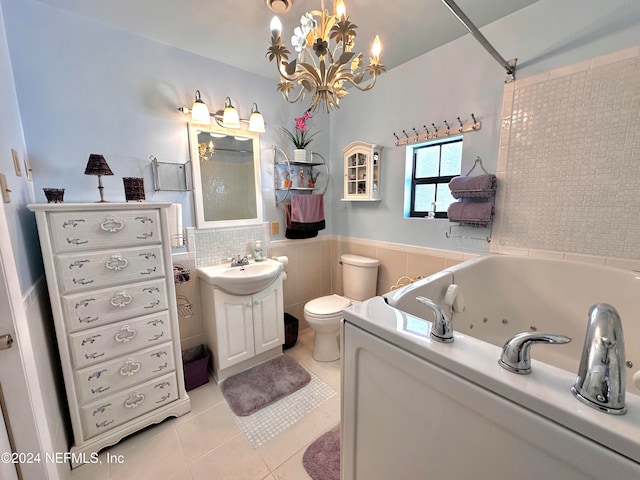 bathroom featuring toilet, tile patterned flooring, a washtub, vanity, and tile walls