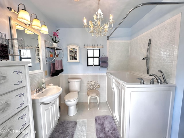 5609 County Road 352, Keystone Heights, FL 32656 - full bath with tile patterned floors, washer / dryer, vanity, a bath, and a wainscoted wall
