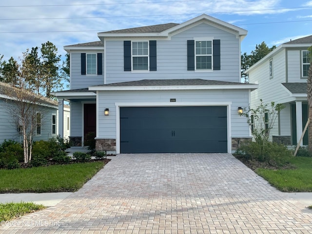 front facade with a garage