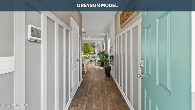 corridor with dark wood-type flooring