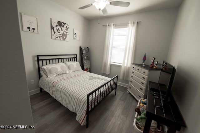 bedroom featuring dark hardwood / wood-style floors and ceiling fan