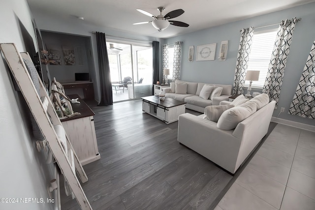 living room featuring hardwood / wood-style floors, ceiling fan, and a healthy amount of sunlight