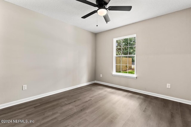 unfurnished room featuring ceiling fan, a textured ceiling, and dark hardwood / wood-style flooring