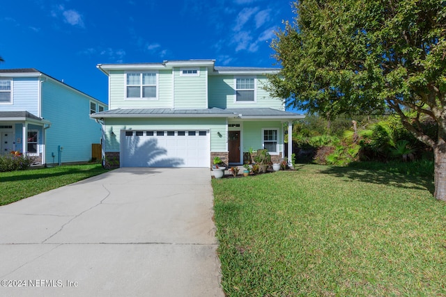 front of property with covered porch, a front yard, and a garage