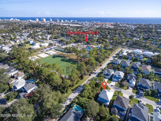 birds eye view of property with a residential view and a water view