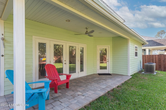 view of patio with ceiling fan, fence, french doors, and central AC unit