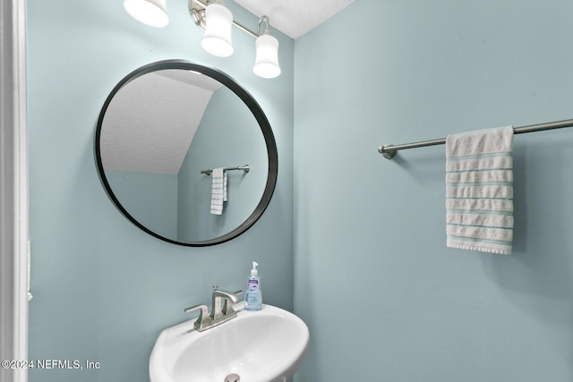 bathroom with a sink and a textured ceiling